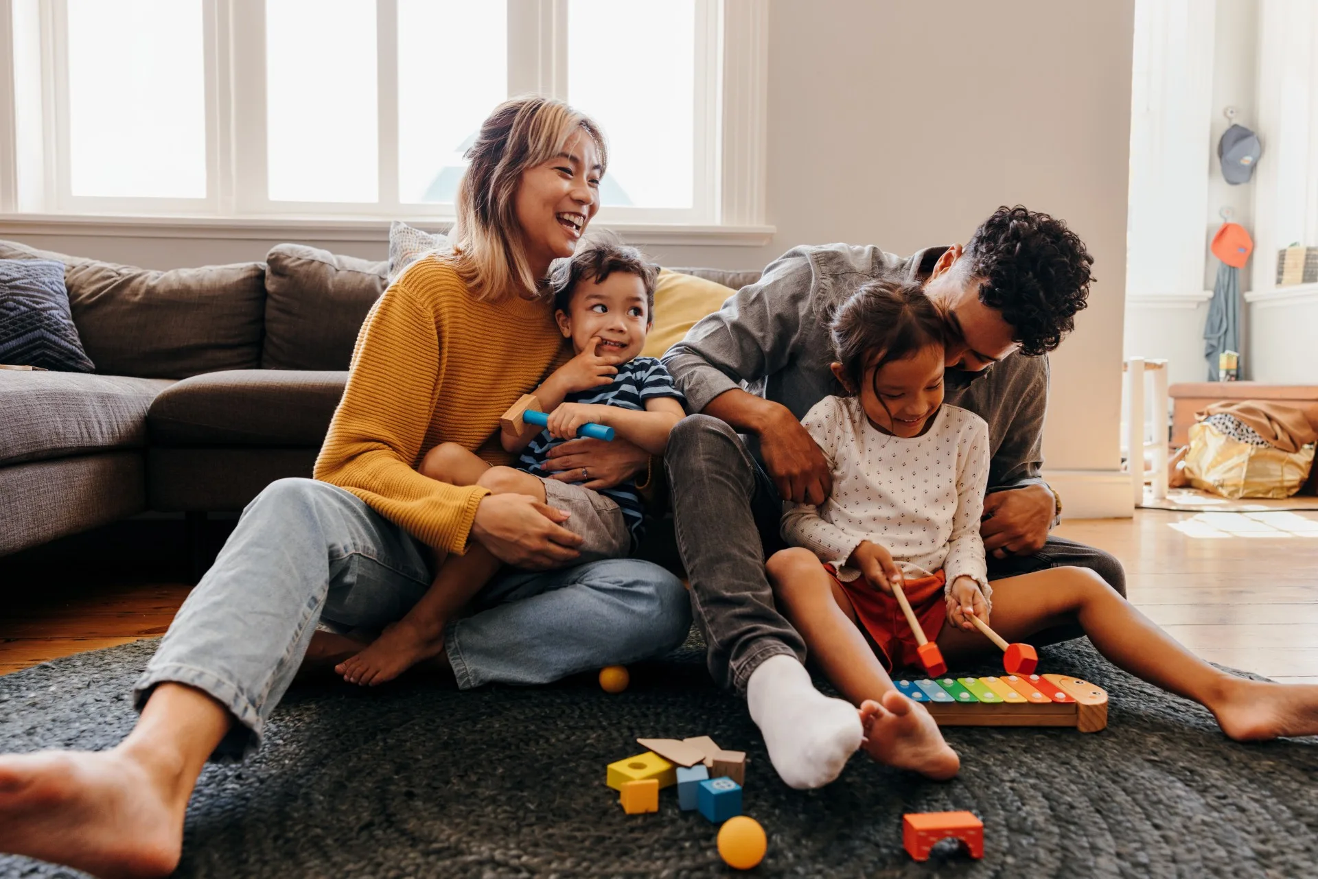 Young parents having fun with their children