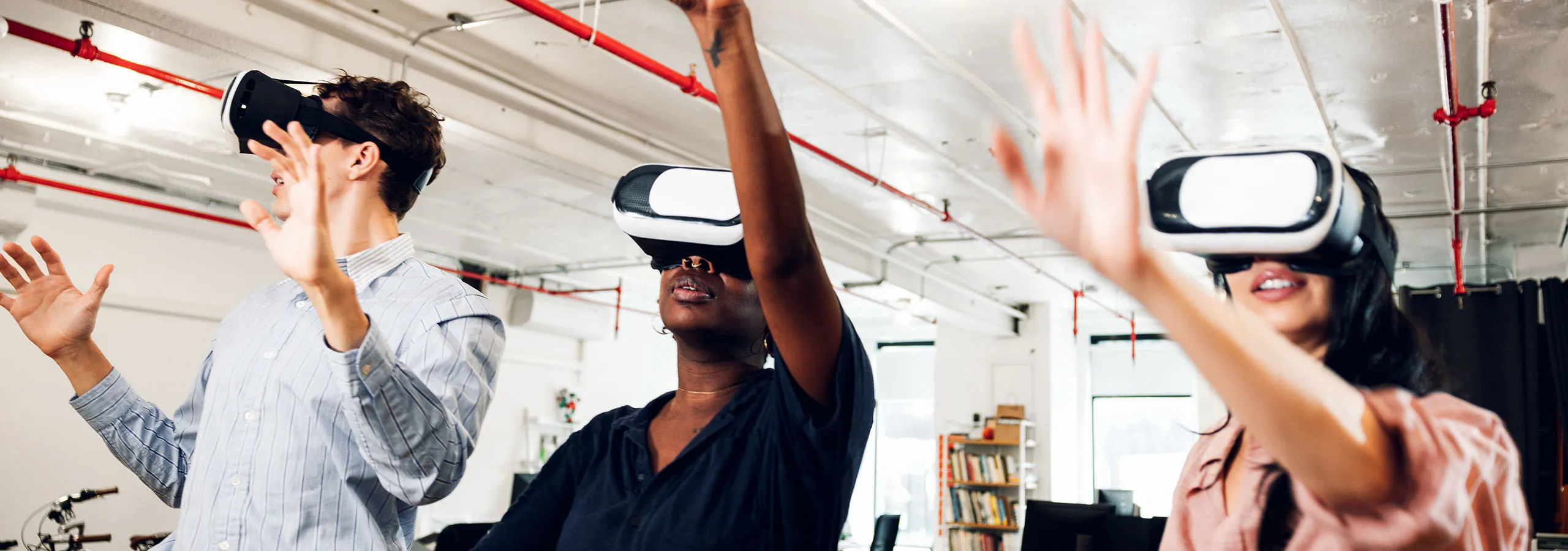 A group of people with VR headsets on