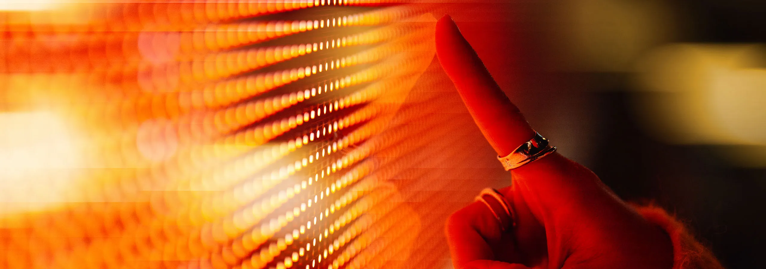 A finger pointing at a screen