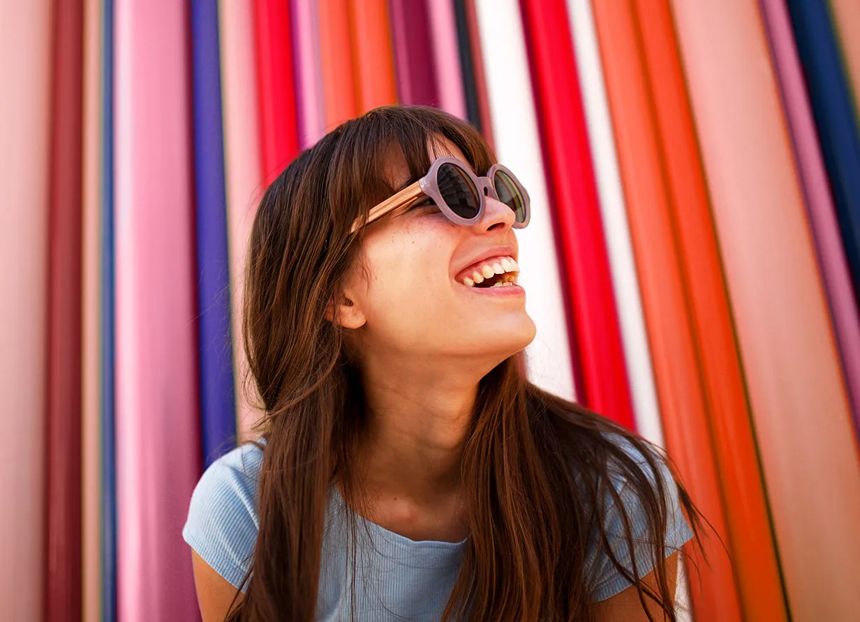 A happy lady with sunglasses on