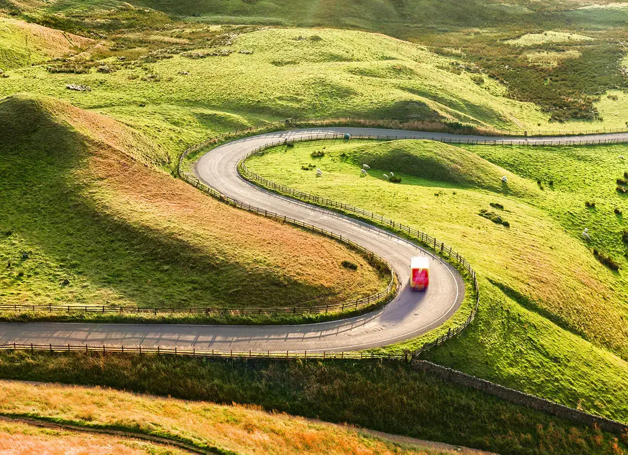 A car driving in the countryside