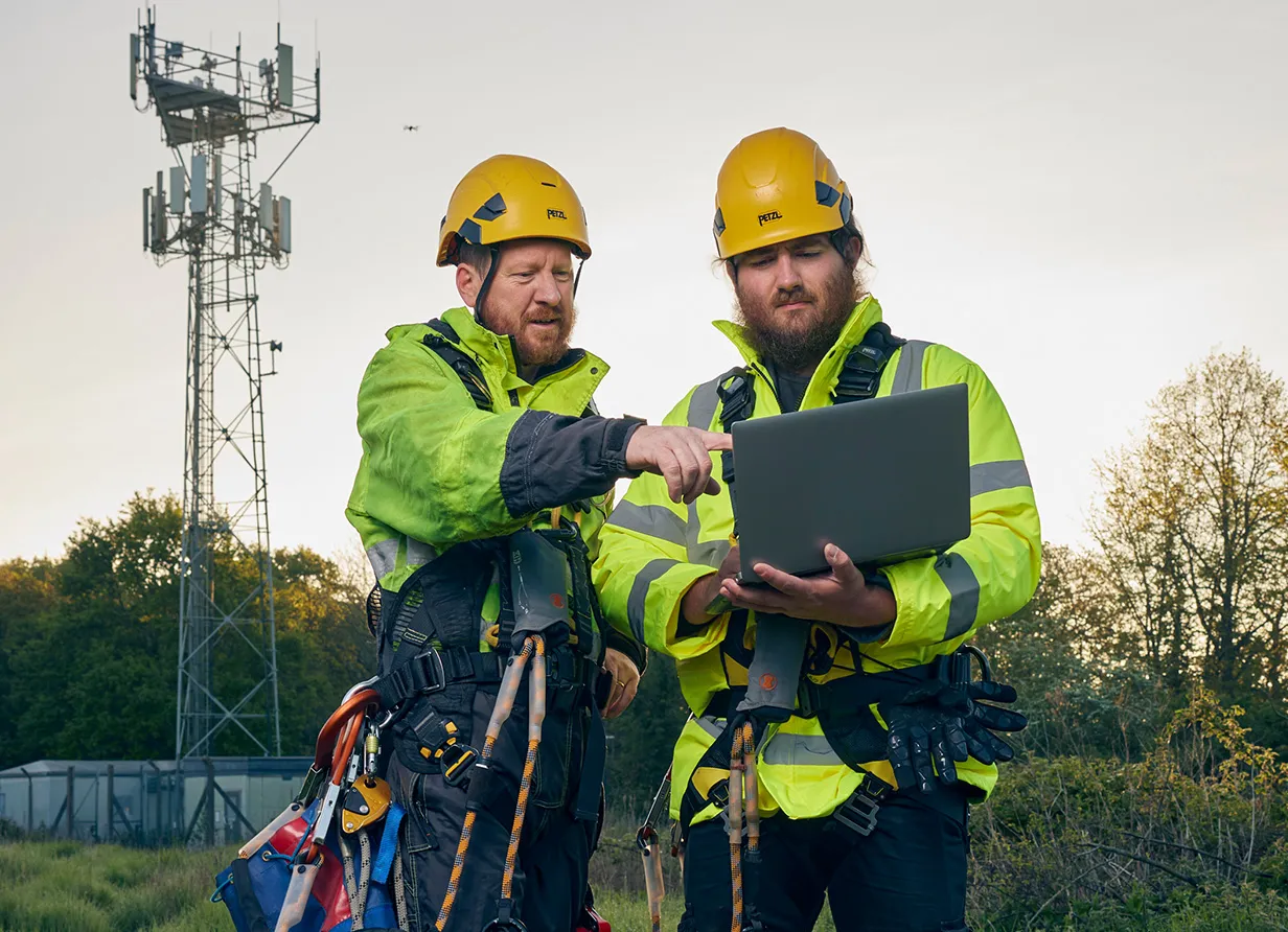 two men with a laptop
