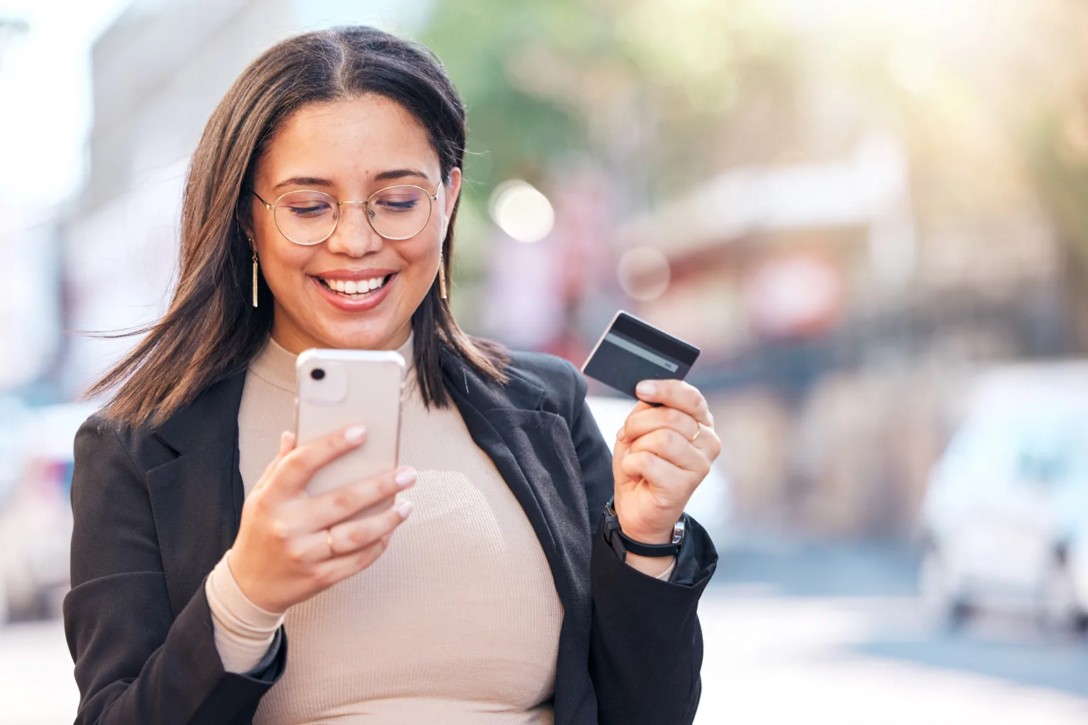 women using smartphone and credit card