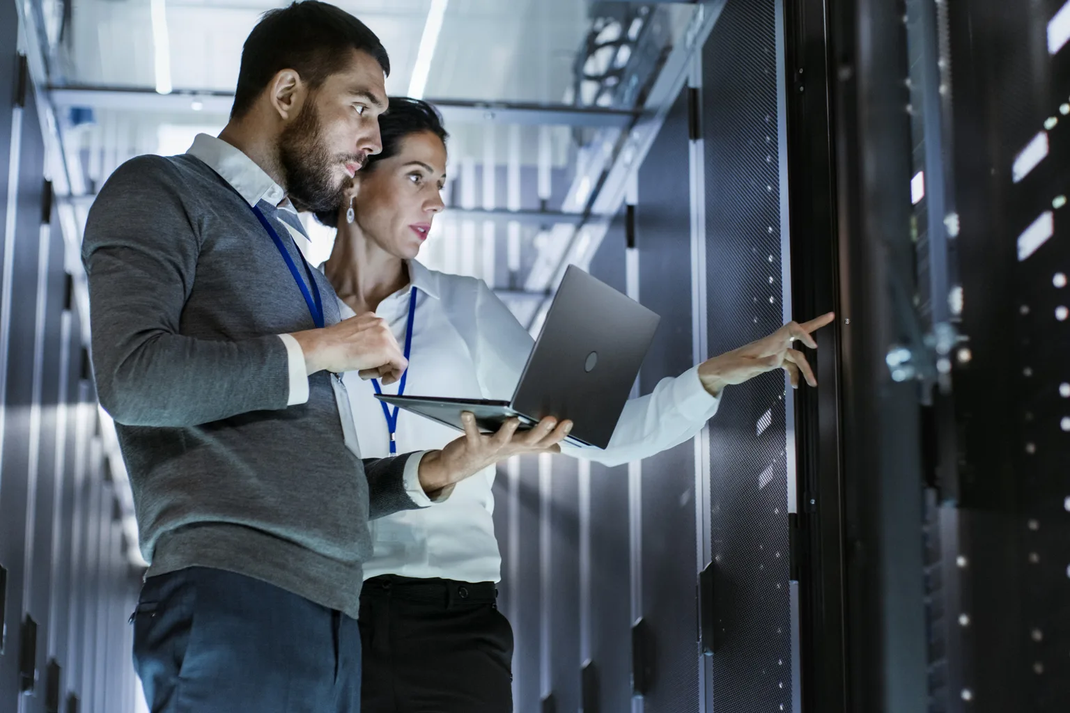 man and woman in data centre