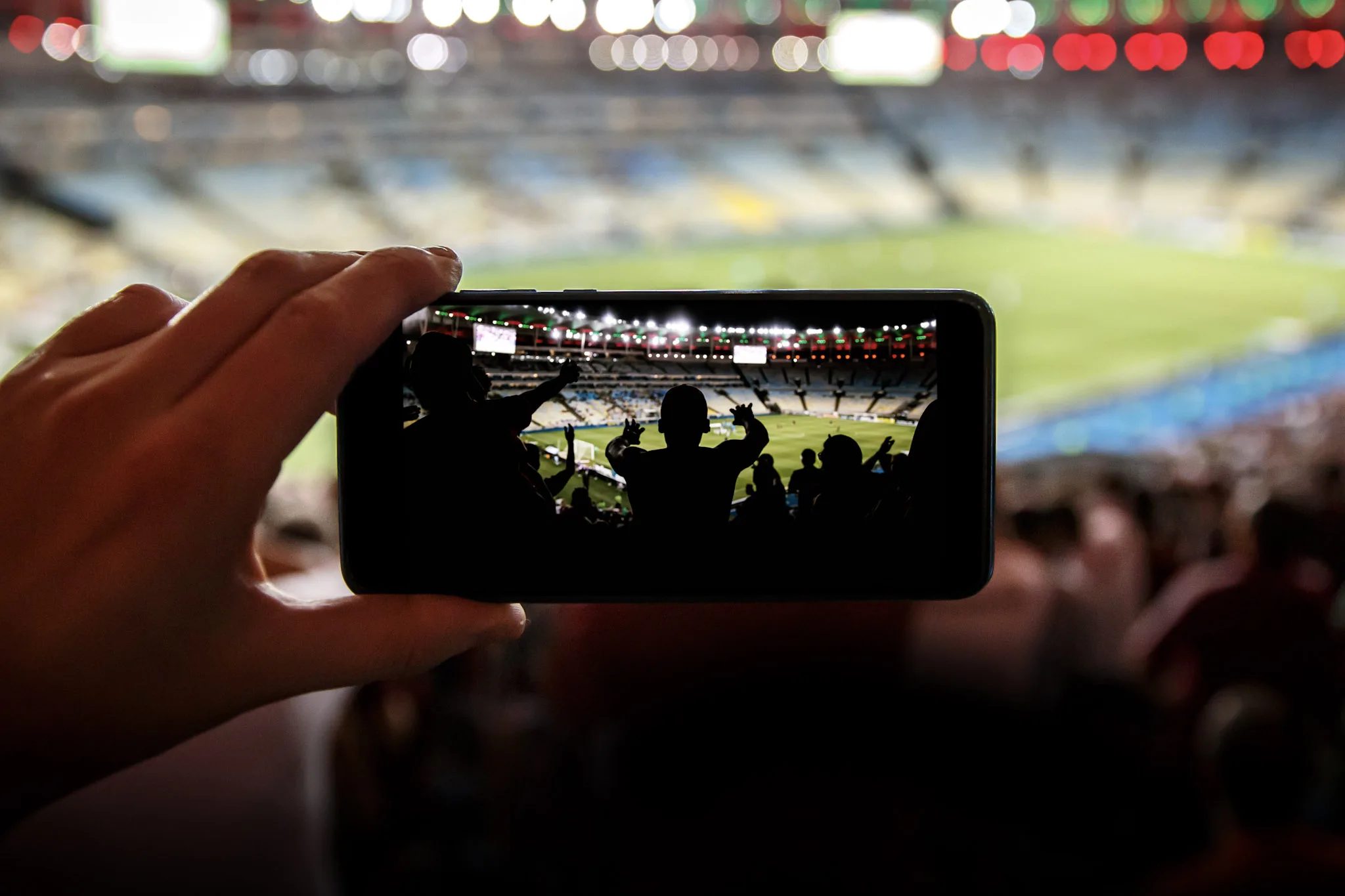 football stadium smartphone crowd