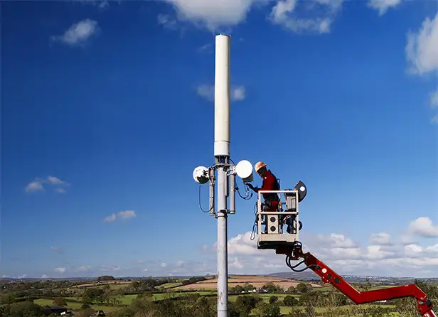 Man working on a phone mast