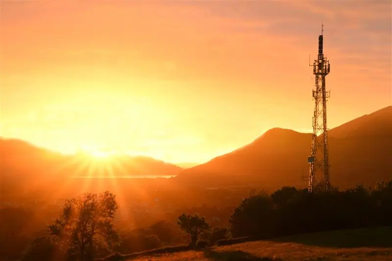 Network mast at sunset
