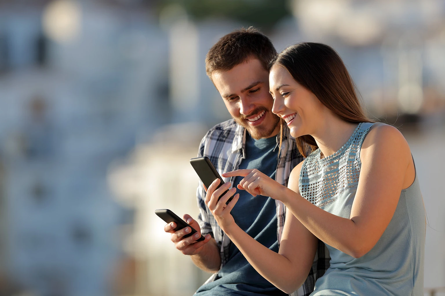 A man and lady looking at a phone