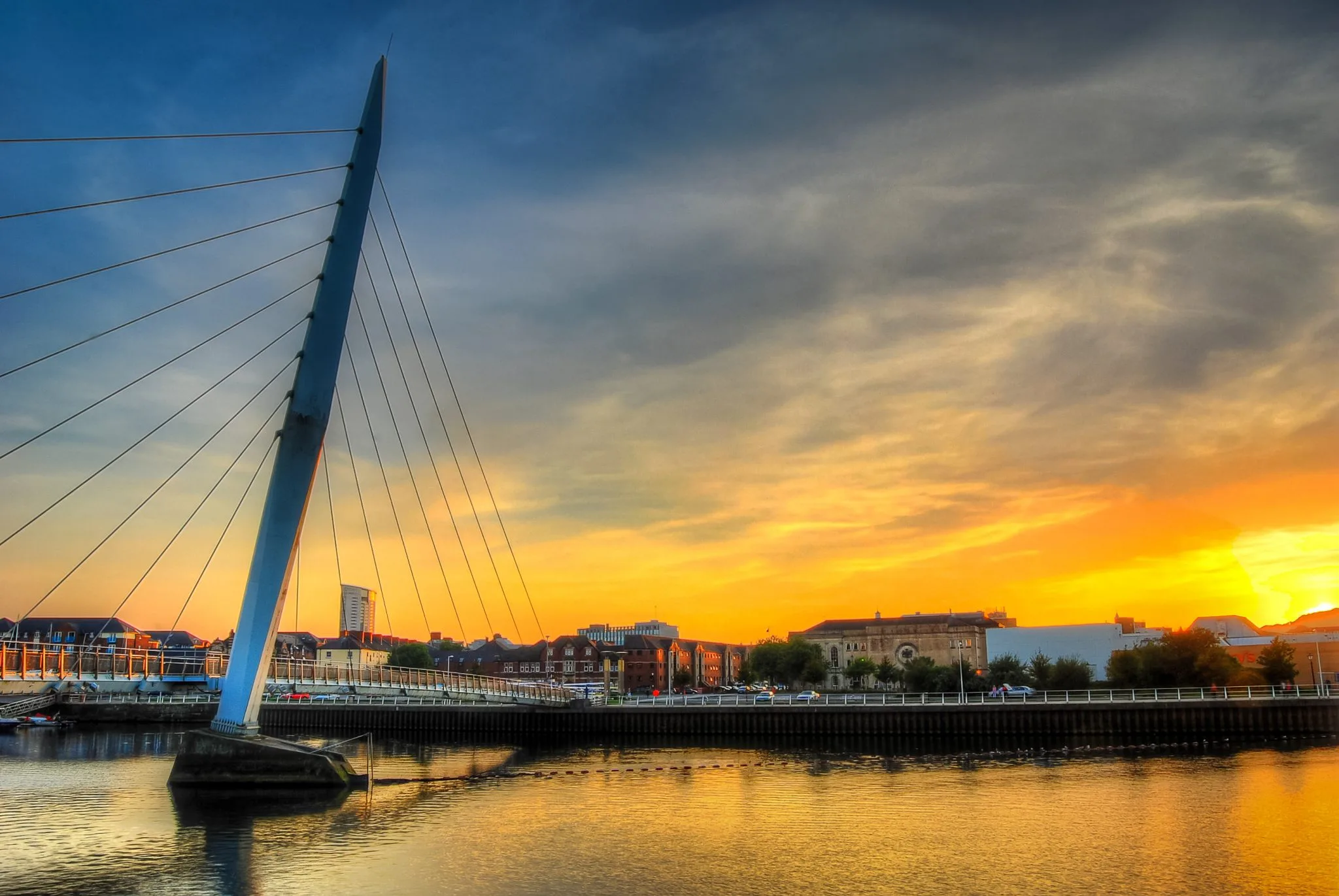 Swansea Millennium Bridge at sunset.